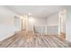 A second-floor landing features hardwood floors, white walls, and natural light from nearby windows at 7001 New Town Rd, Waxhaw, NC 28173