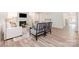 Bright and open living room with hardwood floors and a fireplace at 7001 New Town Rd, Waxhaw, NC 28173
