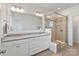 Bathroom with a double vanity, granite countertop, a frameless glass shower and neutral tile at 7957 Reunion Row Dr, Charlotte, NC 28277