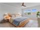 Spacious bedroom with bright natural light, carpet, and a ceiling fan for added comfort at 7957 Reunion Row Dr, Charlotte, NC 28277