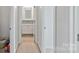 Hallway showcasing easy access to the bathroom and bedroom at 7957 Reunion Row Dr, Charlotte, NC 28277
