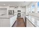 Updated kitchen with stainless steel appliances, granite countertops, white cabinetry and plenty of light at 7957 Reunion Row Dr, Charlotte, NC 28277