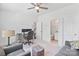 Bright home office featuring neutral decor and a partial view of an adjacent bathroom at 7957 Reunion Row Dr, Charlotte, NC 28277
