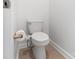 Powder room features a comfort height toilet, bidet attachment, and towel storage at 7957 Reunion Row Dr, Charlotte, NC 28277
