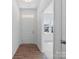 Bright foyer with hardwood floors and natural light. Includes coat closet at 1030 Mapletree Ln, Indian Trail, NC 28079