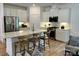 Modern kitchen featuring white cabinets, stainless steel appliances, and an island with seating at 1030 Mapletree Ln, Indian Trail, NC 28079