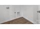 Laundry room with white walls, LVP flooring and hookups at 1030 Mapletree Ln, Indian Trail, NC 28079
