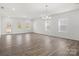 Bright, open living room with hardwood floors and plenty of natural light at 1030 Mapletree Ln, Indian Trail, NC 28079