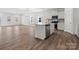 Open-concept living area featuring ample natural light and hardwood floors at 1030 Mapletree Ln, Indian Trail, NC 28079