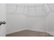 Spacious walk-in closet with carpet flooring and wire shelving at 1030 Mapletree Ln, Indian Trail, NC 28079