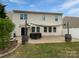 Spacious backyard with stone patio, string lights, perfect for relaxation and outdoor gatherings at 1082 Wallace Lake Rd, Fort Mill, SC 29707