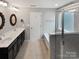 Modern bathroom featuring a double sink vanity, soaking tub, and glass-enclosed shower at 1082 Wallace Lake Rd, Fort Mill, SC 29707