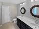 Bathroom features double sinks and decorative mirrors at 1082 Wallace Lake Rd, Fort Mill, SC 29707