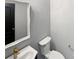 Powder room features a vanity with stylish fixtures and a framed mirror at 1082 Wallace Lake Rd, Fort Mill, SC 29707