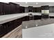 Kitchen features dark cabinetry, granite countertops, stainless steel appliances and subway tile backsplash at 1082 Wallace Lake Rd, Fort Mill, SC 29707