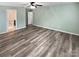 Light-filled living room boasts modern wood-look flooring, creating a seamless and stylish living space at 1082 Wallace Lake Rd, Fort Mill, SC 29707