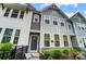 Charming townhouse with gray siding, stone accents, and a well-manicured front yard at 1112 Drummond Ave, Charlotte, NC 28205
