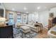 Bright living room with large sectional couch, hardwood floors, and stylish decor at 1112 Drummond Ave, Charlotte, NC 28205