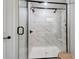Modern glass shower with marble tile and dual shower heads at 1112 Drummond Ave, Charlotte, NC 28205