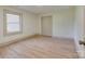 A bright bedroom features natural light, neutral walls, and a closet for efficient storage at 1209 Mount Ulla Hwy, Mooresville, NC 28115