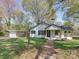 Charming one-story home with white siding, black shutters, a brick walkway, and a detached carport at 1209 Mount Ulla Hwy, Mooresville, NC 28115