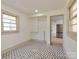 Flex room with decorative black and white tiled floors and a view to the eat-in kitchen at 1209 Mount Ulla Hwy, Mooresville, NC 28115