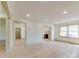 Spacious living room with neutral walls, light floors, many windows, and access to other rooms at 1209 Mount Ulla Hwy, Mooresville, NC 28115