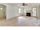 Cozy living room features a fireplace, neutral walls, light floors, and plenty of natural light at 1209 Mount Ulla Hwy, Mooresville, NC 28115