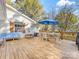 Spacious back deck with outdoor seating and wooden railings, ideal for enjoying the outdoors at 1210 Sewickley Dr, Charlotte, NC 28209
