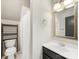 Cozy bathroom featuring a toilet, shower, and sink with vanity, enhanced by modern lighting fixtures at 1210 Sewickley Dr, Charlotte, NC 28209