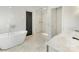 This luxurious bathroom features a standalone tub and a glass-enclosed shower at 1210 Sewickley Dr, Charlotte, NC 28209