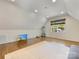 Spacious bonus room with hardwood floors, recessed lighting, and a large window offering natural light at 1210 Sewickley Dr, Charlotte, NC 28209