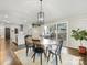 Dining room showcasing wood table, black chairs, and sliding glass doors to patio at 1210 Sewickley Dr, Charlotte, NC 28209