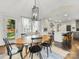 Dining area showing views of kitchen and backyard, with oval table and wood chairs at 1210 Sewickley Dr, Charlotte, NC 28209