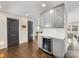 Kitchen featuring built-in wine cooler and upper display cabinets at 1210 Sewickley Dr, Charlotte, NC 28209