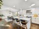 Modern kitchen featuring an eat-in island, stainless steel appliances, and a seamless connection to the dining area at 1210 Sewickley Dr, Charlotte, NC 28209