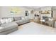 Bright and airy living room with comfortable seating and neutral colors, flowing into the kitchen at 1210 Sewickley Dr, Charlotte, NC 28209