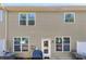 Exterior view of the home's siding, backyard patio, and multiple windows bringing in natural light at 1212 Croft Dr, Fort Mill, SC 29708
