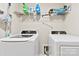 Functional laundry room with modern washer and dryer units to enhance the ease of household chores at 1212 Croft Dr, Fort Mill, SC 29708