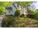 Charming home featuring a well-maintained yard with manicured landscaping and a classic picket fence at 1220 Oakwood Ave, Gastonia, NC 28052