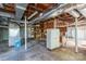 Unfinished basement with shelving, storage cabinet and exposed ductwork at 1220 Oakwood Ave, Gastonia, NC 28052