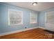 Charming bedroom featuring hardwood floors and sunlit windows at 1220 Oakwood Ave, Gastonia, NC 28052