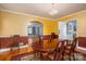 Formal dining room featuring hardwood floors, wainscoting, and chandelier lighting at 1220 Oakwood Ave, Gastonia, NC 28052