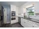 Updated kitchen boasts stainless steel appliances, granite counters, and marble backsplash at 1220 Oakwood Ave, Gastonia, NC 28052
