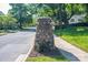 Community entrance with a decorative stone sign reading 'Brookwood', surrounded by lush greenery and trees at 1220 Oakwood Ave, Gastonia, NC 28052
