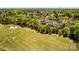 Aerial view of the home highlighting the property location close to the green golf course at 12531 Kane Alexander Dr, Huntersville, NC 28078