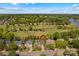 Aerial view of the home highlighting the property and neighborhood near the green golf course at 12531 Kane Alexander Dr, Huntersville, NC 28078