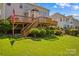 Spacious backyard featuring a deck, lush lawn, and ample space for outdoor activities at 12531 Kane Alexander Dr, Huntersville, NC 28078