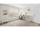 Bright room with a desk, chair, white shelving, and a large window overlooking a tree at 12531 Kane Alexander Dr, Huntersville, NC 28078