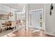 Inviting foyer with hardwood floors, featuring a view of the dining room and abundant natural light at 12531 Kane Alexander Dr, Huntersville, NC 28078